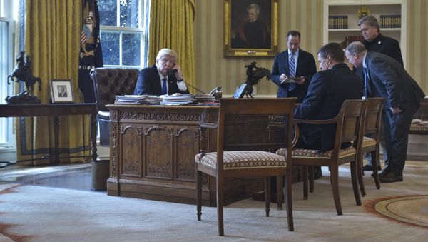 US President Donald Trump speaks on the phone with Russia's President Vladimir Putin from the Oval Office of the White House on January 28, 2017, in Washington, DC US President Donald Trump speaks on the phone with Russia's President Vladimir Putin from the Oval Office of the White House on January 28, 2017, in Washington, DC - Sputnik International