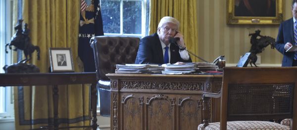 US President Donald Trump speaks on the phone with Russia's President Vladimir Putin from the Oval Office of the White House on January 28, 2017, in Washington, DC US President Donald Trump speaks on the phone with Russia's President Vladimir Putin from the Oval Office of the White House on January 28, 2017, in Washington, DC - Sputnik International