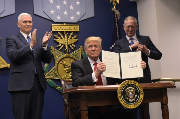 US President Donald Trump shows his signature on executive orders alongside US Defense Secretary James Mattis and US Vice President Muike Pence on January 27, 2017, at the Pentagon in Washington, DC US President Donald Trump shows his signature on executive orders alongside US Defense Secretary James Mattis and US Vice President Muike Pence on January 27, 2017, at the Pentagon in Washington, DC - Sputnik International