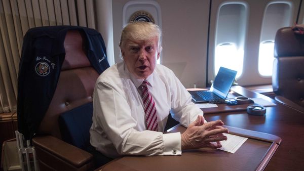 US President Donald Trump poses in his office aboard Air Force One at Andrews Air Force Base in Maryland after he returned from Philadelphia on January 26, 2017 US President Donald Trump poses in his office aboard Air Force One at Andrews Air Force Base in Maryland after he returned from Philadelphia on January 26, 2017 - Sputnik International