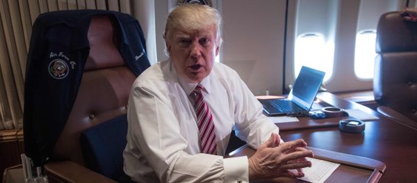 US President Donald Trump poses in his office aboard Air Force One at Andrews Air Force Base in Maryland after he returned from Philadelphia on January 26, 2017 US President Donald Trump poses in his office aboard Air Force One at Andrews Air Force Base in Maryland after he returned from Philadelphia on January 26, 2017 - Sputnik International