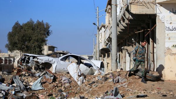 A Syrian government soldier walks near a damaged car on a road to Aleppo, Syria January 29, 2017 A Syrian government soldier walks near a damaged car on a road to Aleppo, Syria January 29, 2017 - Sputnik International