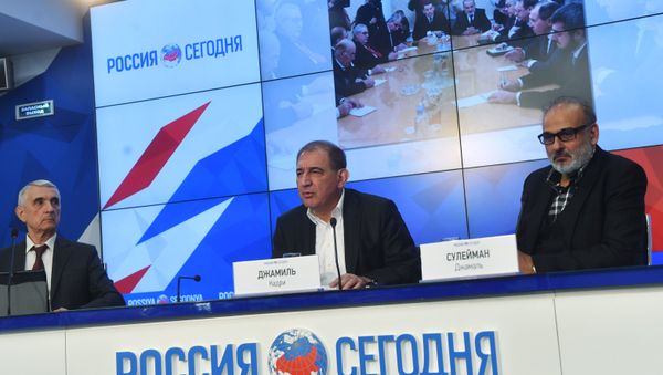 Qadri Jamil, center, chairman of the Syrian opposition's Moscow group, secretary of the People's Will Party and one of the leaders of the Popular Front for Change and Liberation, with Jamal Suleiman, right, a representative of the Syrian opposition's Cairo group, during a news conference at the Rossiya Segodnya International Multimedia Press Center in Moscow Qadri Jamil, center, chairman of the Syrian opposition's Moscow group, secretary of the People's Will Party and one of the leaders of the Popular Front for Change and Liberation, with Jamal Suleiman, right, a representative of the Syrian opposition's Cairo group, during a news conference at the Rossiya Segodnya International Multimedia Press Center in Moscow - Sputnik International