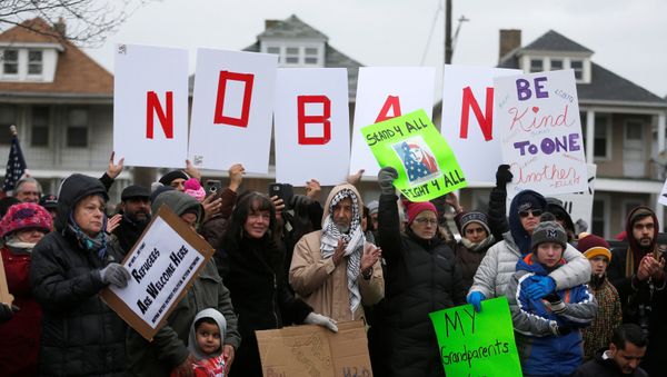 Several hundred people rally against a temporary travel ban signed by U.S. President Donald Trump in an executive order during a protest in Hamtramck, Michigan, U.S., January 29, 2017 Several hundred people rally against a temporary travel ban signed by U.S. President Donald Trump in an executive order during a protest in Hamtramck, Michigan, U.S., January 29, 2017 - Sputnik International