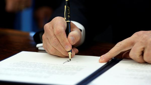 U.S. President Donald Trump signs a memorandum to security services directing them to defeat the Islamic State in the Oval Office at the White House in Washington, U.S. January 28, 2017 U.S. President Donald Trump signs a memorandum to security services directing them to defeat the Islamic State in the Oval Office at the White House in Washington, U.S. January 28, 2017 - Sputnik International