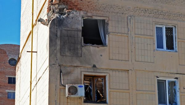 Shattered windows in a residential building in Donetsk, damaged during a shelling by the Ukrainian military - Sputnik International