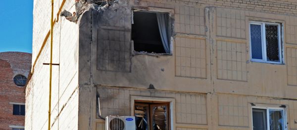 Shattered windows in a residential building in Donetsk, damaged during a shelling by the Ukrainian military - Sputnik International