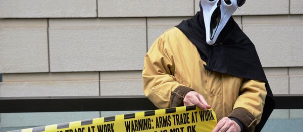A demonstrator from 'Stop G8' is pictured outside the offices of BAE Systems in London on June 12, 2013, during a protest against the G8 Summit. A demonstrator from 'Stop G8' is pictured outside the offices of BAE Systems in London on June 12, 2013, during a protest against the G8 Summit. - Sputnik International