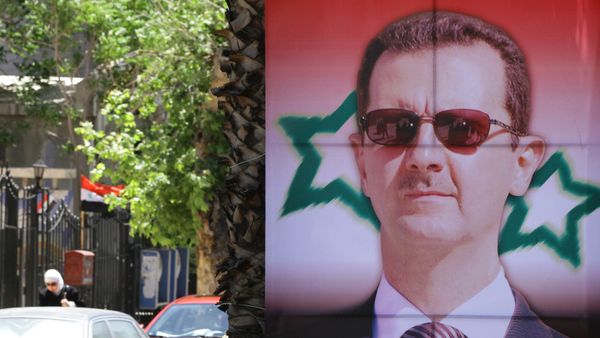 Poster bearing a portrait of President Bashar al-Assad Poster bearing a portrait of President Bashar al-Assad - Sputnik International