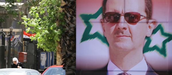 Poster bearing a portrait of President Bashar al-Assad - Sputnik International