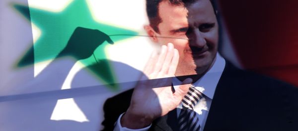The silhouette of a Syrian man is seen through an election campaign portrait of President Bashar al-Assad he hangs it on a billboard on May 11, 2014 in the capital Damascus. The silhouette of a Syrian man is seen through an election campaign portrait of President Bashar al-Assad he hangs it on a billboard on May 11, 2014 in the capital Damascus. - Sputnik International