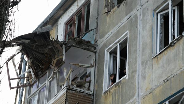 A residential building damaged by an attack of the Ukrainian armed forces in Donetsk A residential building damaged by an attack of the Ukrainian armed forces in Donetsk - Sputnik International