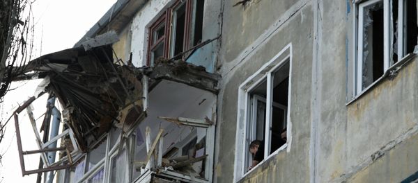 A residential building damaged by an attack of the Ukrainian armed forces in Donetsk - Sputnik International