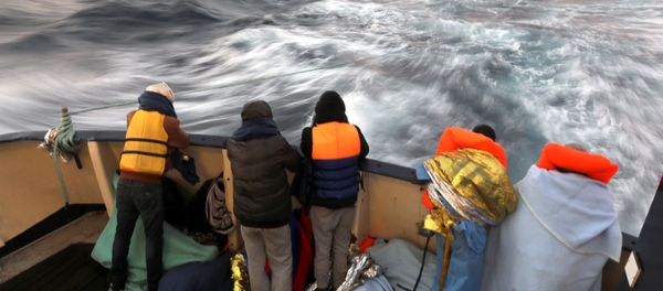 Migrants are seen at the stern of the former fishing trawler Golfo Azzurro of the Spanish NGO Proactiva Open Arms, a day after they were rescued along with other migrants near the coasts of Libya, in the central Mediterranean Sea, January 28, 2017. Migrants are seen at the stern of the former fishing trawler Golfo Azzurro of the Spanish NGO Proactiva Open Arms, a day after they were rescued along with other migrants near the coasts of Libya, in the central Mediterranean Sea, January 28, 2017. - Sputnik International