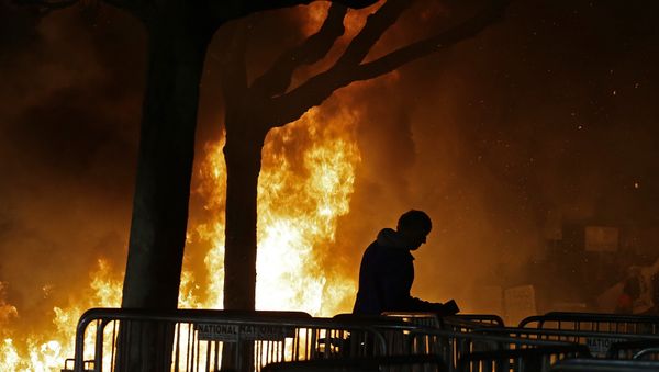 A bonfire set by demonstrators protesting a scheduled speaking appearance by Breitbart News editor Milo Yiannopoulos burns on Sproul Plaza on the University of California at Berkeley campus on Wednesday, Feb. 1, 2017, in Berkeley, Calif. A bonfire set by demonstrators protesting a scheduled speaking appearance by Breitbart News editor Milo Yiannopoulos burns on Sproul Plaza on the University of California at Berkeley campus on Wednesday, Feb. 1, 2017, in Berkeley, Calif. - Sputnik International