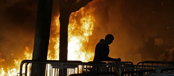 A bonfire set by demonstrators protesting a scheduled speaking appearance by Breitbart News editor Milo Yiannopoulos burns on Sproul Plaza on the University of California at Berkeley campus on Wednesday, Feb. 1, 2017, in Berkeley, Calif. A bonfire set by demonstrators protesting a scheduled speaking appearance by Breitbart News editor Milo Yiannopoulos burns on Sproul Plaza on the University of California at Berkeley campus on Wednesday, Feb. 1, 2017, in Berkeley, Calif. - Sputnik International