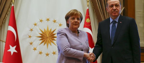 Turkish President Recep Tayyip Erdogan and German Chancellor Angela Merkel exchange a handshake at the presidential palace during the first visit since July's failed coup in Ankara, Turkey, February 2, 2017. Turkish President Recep Tayyip Erdogan and German Chancellor Angela Merkel exchange a handshake at the presidential palace during the first visit since July's failed coup in Ankara, Turkey, February 2, 2017. - Sputnik International