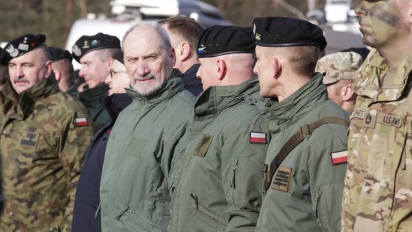 Polish Defense Minister Antoni Macierewicz, fourth right, stands with soldiers during the opening of joint Polish and U.S. exercise on training fields in Zagan, Poland, Monday, Jan. 30, 2017 - Sputnik International