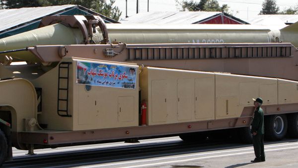 A member of Iranian Corps Guards of the Islamic Revolution forces looks at a Shahab 3 missile during large-scale military parades in Tehran (File) A member of Iranian Corps Guards of the Islamic Revolution forces looks at a Shahab 3 missile during large-scale military parades in Tehran (File) - Sputnik International