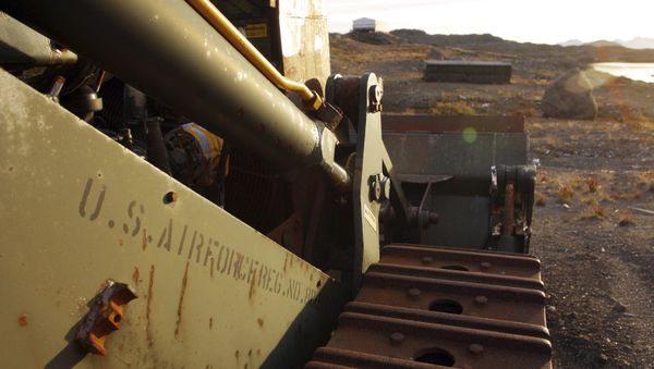 In this file photo dated Aug. 16, 2005, an abandoned US Air Force vehicle is seen on Aug. 16, 2005, outside the eastern Greenland settlement of Kulusuk where there used to be a U.S. Air Force base as part of an early warning radar system - Sputnik International