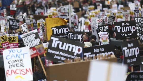 Demonstrators march against U.S. President Donald Trump and his temporary ban on refugees and nationals from seven Muslim-majority countries from entering the United States, during a protest in London, Britain, February 4, 2017 - Sputnik International