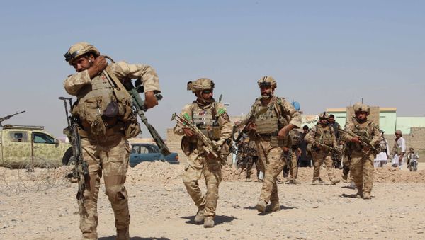 Afghan National Army commandos take position during a military operation in Helmand province (File) Afghan National Army commandos take position during a military operation in Helmand province (File) - Sputnik International