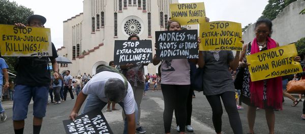 Human rights activists display placards outside the Baclaran Church prior to a mass in suburban Paranaque, south of Manila, Philippines. - Sputnik International