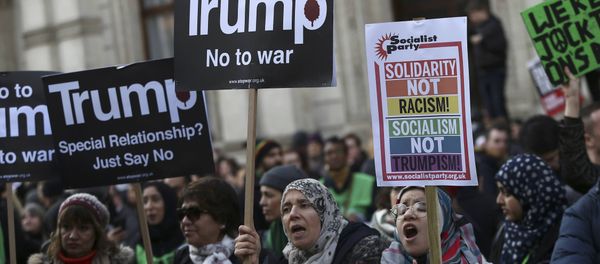 Demonstrators hold placards outside Downing Street during a march against U.S. President Donald Trump and his temporary ban on refugees and nationals from seven Muslim-majority countries from entering the United States, in London, Britain, February 4, 2017 Demonstrators hold placards outside Downing Street during a march against U.S. President Donald Trump and his temporary ban on refugees and nationals from seven Muslim-majority countries from entering the United States, in London, Britain, February 4, 2017 - Sputnik International