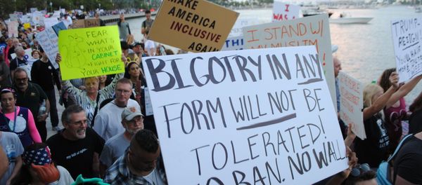 People protest outside the Trump Plaza Hotel against the executive orders issued by US President Donald Trump, February 4, 2017 in West Palm Beach, Florida People protest outside the Trump Plaza Hotel against the executive orders issued by US President Donald Trump, February 4, 2017 in West Palm Beach, Florida - Sputnik International