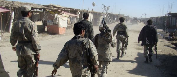 Afghan troops walk through the village of Laki , in Helmand province's Garmsir district, south of Kabul, Afghanistan (File) - Sputnik International