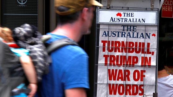 A pedestrian looks at a newspaper headline regarding U.S. President Donald Trump and Australian Prime Minister Malcolm Turnbull in central Sydney, Australia, February 3, 2017 A pedestrian looks at a newspaper headline regarding U.S. President Donald Trump and Australian Prime Minister Malcolm Turnbull in central Sydney, Australia, February 3, 2017 - Sputnik International