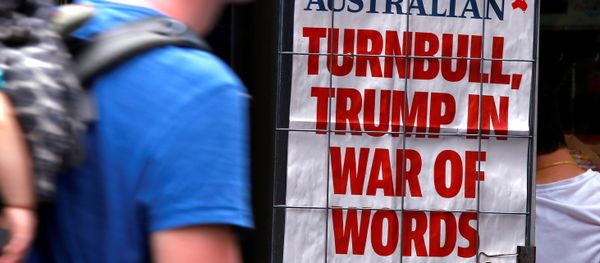 A pedestrian looks at a newspaper headline regarding U.S. President Donald Trump and Australian Prime Minister Malcolm Turnbull in central Sydney, Australia, February 3, 2017 A pedestrian looks at a newspaper headline regarding U.S. President Donald Trump and Australian Prime Minister Malcolm Turnbull in central Sydney, Australia, February 3, 2017 - Sputnik International