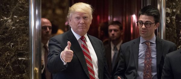 President-elect Donald Trump gives a thumbs up to members of the media after meeting with Martin Luther King III, son of Martin Luther King Jr., at Trump Tower in New York, Monday, Jan. 16, 2017 - Sputnik International