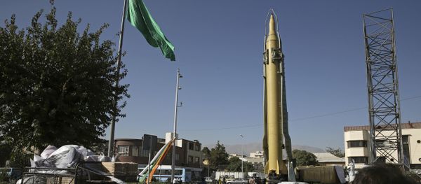 Iranians walk past a Ghadr-F missile displayed at a Revolutionary Guard hardware exhibition, marking 36th anniversary of the outset of Iran-Iraq war, at Baharestan Sq. in downtown Tehran, Iran (File) Iranians walk past a Ghadr-F missile displayed at a Revolutionary Guard hardware exhibition, marking 36th anniversary of the outset of Iran-Iraq war, at Baharestan Sq. in downtown Tehran, Iran (File) - Sputnik International