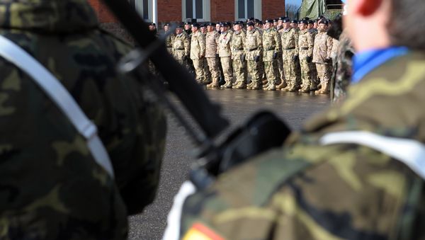 Members of Eurocorps military contingent take part in a ceremony in honor of the families of the 150 soldiers who will go to Afghanistan on January 10 for a six-month-period joining Afghanistan International Security Assistance Force (FIAS), on January 4, 2012 at Eurocorps headquarters in Strasbourg, eastern France - Sputnik International