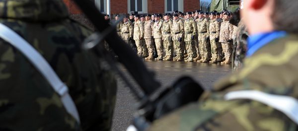 Members of Eurocorps military contingent take part in a ceremony in honor of the families of the 150 soldiers who will go to Afghanistan on January 10 for a six-month-period joining Afghanistan International Security Assistance Force (FIAS), on January 4, 2012 at Eurocorps headquarters in Strasbourg, eastern France - Sputnik International