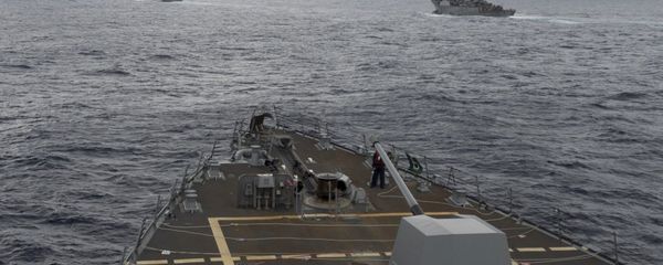 This image provided by the U.S. Navy, taken Oct. 17, 2016, shows the guided missile destroyer USS Decatur, right, pulling into position behind the Military Sealift Command USNS Matthew Perry, during a replenishment-at-sea, seen from the bridge of the guided-missile destroyer USS Spruance, in the South China Sea This image provided by the U.S. Navy, taken Oct. 17, 2016, shows the guided missile destroyer USS Decatur, right, pulling into position behind the Military Sealift Command USNS Matthew Perry, during a replenishment-at-sea, seen from the bridge of the guided-missile destroyer USS Spruance, in the South China Sea - Sputnik International