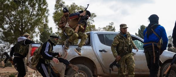 Fighters from the Free Syrian Army disembark from an armoured vehicle near the town of Bizaah northeast of the city of Al-Bab, some 30 kilometres from the Syrian city of Aleppo, on February 4, 2017 Fighters from the Free Syrian Army disembark from an armoured vehicle near the town of Bizaah northeast of the city of Al-Bab, some 30 kilometres from the Syrian city of Aleppo, on February 4, 2017 - Sputnik International