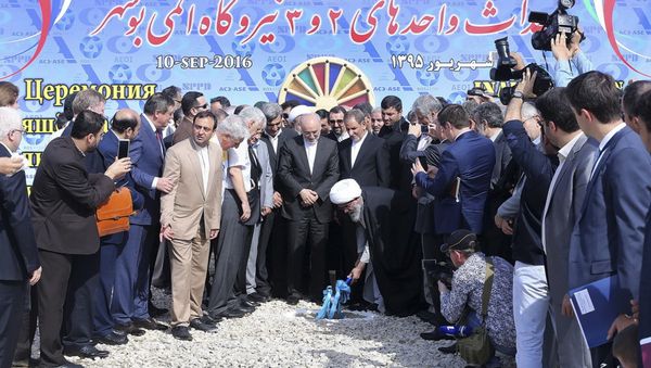 Iranian Senior Vice-President on Saturday, Sept. 10, 2016, Ayatollah Gholam Ali Safaei Bushehri, Supreme Leader Ali Khamenei's representative in Bushehr province, center bottom, breaks ground in a ceremony to begin building Iran's second nuclear power plant in the southern port city of Bushehr, Iran - Sputnik International