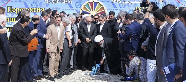 Iranian Senior Vice-President on Saturday, Sept. 10, 2016, Ayatollah Gholam Ali Safaei Bushehri, Supreme Leader Ali Khamenei's representative in Bushehr province, center bottom, breaks ground in a ceremony to begin building Iran's second nuclear power plant in the southern port city of Bushehr, Iran Iranian Senior Vice-President on Saturday, Sept. 10, 2016, Ayatollah Gholam Ali Safaei Bushehri, Supreme Leader Ali Khamenei's representative in Bushehr province, center bottom, breaks ground in a ceremony to begin building Iran's second nuclear power plant in the southern port city of Bushehr, Iran - Sputnik International