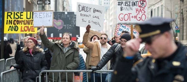 Anti-Trump protesters shout at supporters of US President Donald Trump during a rally near Trump Tower in Fifth Avenue, February 5, 2017 in New York - Sputnik International