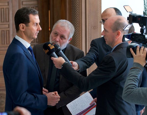 Syria's President Bashar al-Assad speaks to a group of Belgian reporters in this handout picture provided by SANA on February 7, 2017, Syria - Sputnik International