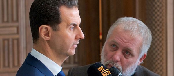 Syria's President Bashar al-Assad speaks to a group of Belgian reporters in this handout picture provided by SANA on February 7, 2017, Syria Syria's President Bashar al-Assad speaks to a group of Belgian reporters in this handout picture provided by SANA on February 7, 2017, Syria - Sputnik International