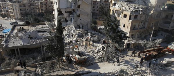 People inspect the damage at a site hit by airstrikes in the rebel-held city of Idlib, Syria February 7, 2017 - Sputnik International