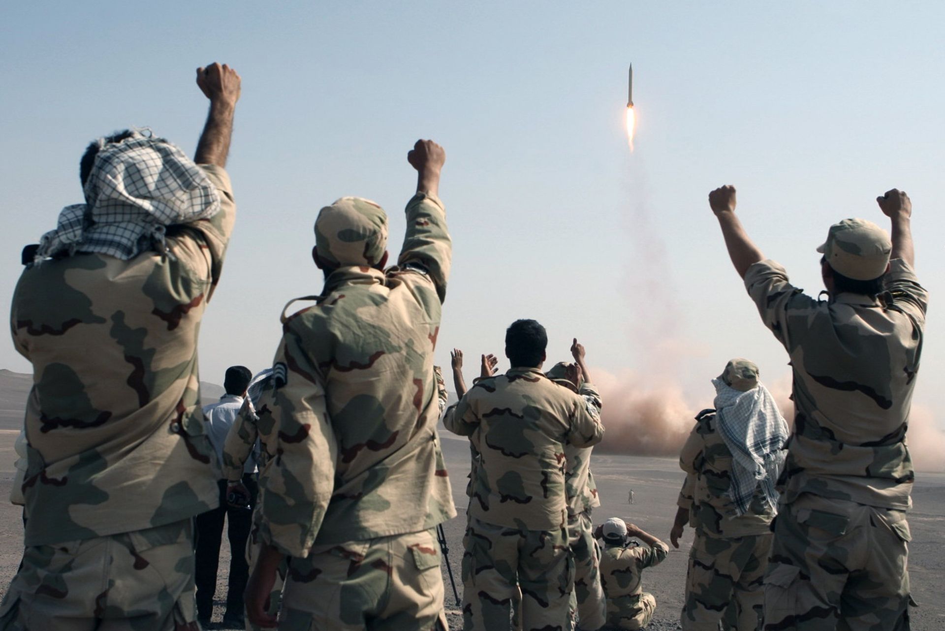 In this photo released by the Islamic Republic News Agency (IRNA), members of the Iranian Revolutionary Guard celebrate after launching a missile during their maneuver in an undisclosed location in Iran (File) - Sputnik International, 1920, 19.01.2023