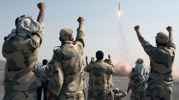In this photo released by the Islamic Republic News Agency (IRNA), members of the Iranian Revolutionary Guard celebrate after launching a missile during their maneuver in an undisclosed location in Iran, Tuesday, July 3, 2012. Iran's powerful Revolutionary Guards test fired several ballistic missiles on Tuesday, including a long-range variety capable of hitting U.S. bases in the region as well as Israel, Iranian media reported.THE ASSOCIATED PRESS HAS NO WAY OF INDEPENDENTLY VERIFYING THE CONTENT, LOCATION OR DATE OF THIS IMAGE. In this photo released by the Islamic Republic News Agency (IRNA), members of the Iranian Revolutionary Guard celebrate after launching a missile during their maneuver in an undisclosed location in Iran, Tuesday, July 3, 2012. Iran's powerful Revolutionary Guards test fired several ballistic missiles on Tuesday, including a long-range variety capable of hitting U.S. bases in the region as well as Israel, Iranian media reported.THE ASSOCIATED PRESS HAS NO WAY OF INDEPENDENTLY VERIFYING THE CONTENT, LOCATION OR DATE OF THIS IMAGE. - Sputnik International