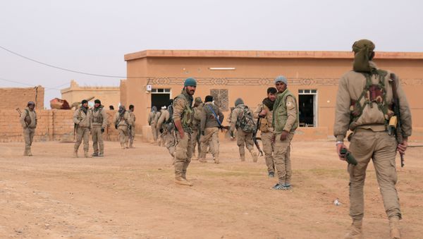 Syrian Democratic Forces (SDF) fighters walk with their weapons during an offensive against Daesh terrorists in northern Raqqa province, Syria Syrian Democratic Forces (SDF) fighters walk with their weapons during an offensive against Daesh terrorists in northern Raqqa province, Syria - Sputnik International