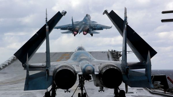 Su-33 and MiG-29K fighters aboard Admiral Kuznetsov heavy aircraft carrier in the Mediterranean Sea. Su-33 and MiG-29K fighters aboard Admiral Kuznetsov heavy aircraft carrier in the Mediterranean Sea. - Sputnik International