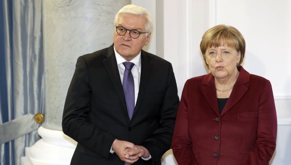 German Chancellor Angela Merkel, right, and German Foreign Minister Frank-Walter Steinmeier, left, talk as they pose for the media during a New Year's reception of German President Joachim Gauck at the Bellevue palace in Berlin, Germany, Tuesday, January 10, 2017. German Chancellor Angela Merkel, right, and German Foreign Minister Frank-Walter Steinmeier, left, talk as they pose for the media during a New Year's reception of German President Joachim Gauck at the Bellevue palace in Berlin, Germany, Tuesday, January 10, 2017. - Sputnik International