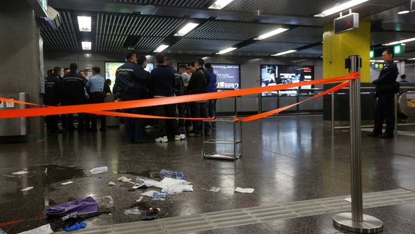Police officers stand guard inside Tsim Sha Tsui subway station in Hong Kong, China - Sputnik International